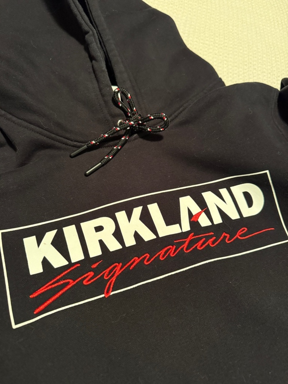Kirkland Signature Black Hoodie with White and Red Logo